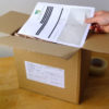 Putting crocodile integrated label into box
