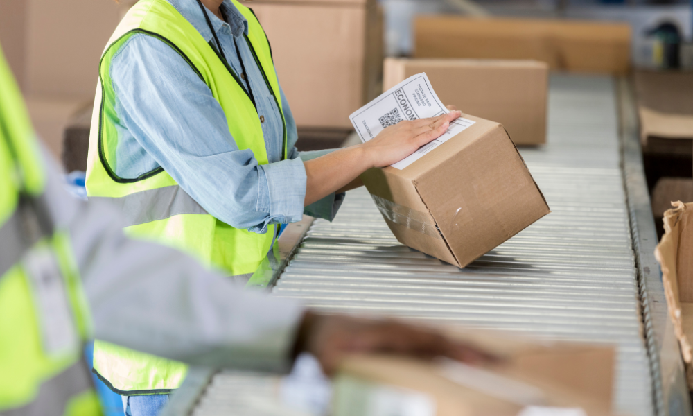 warehousing labels - picture of a label being put on a box